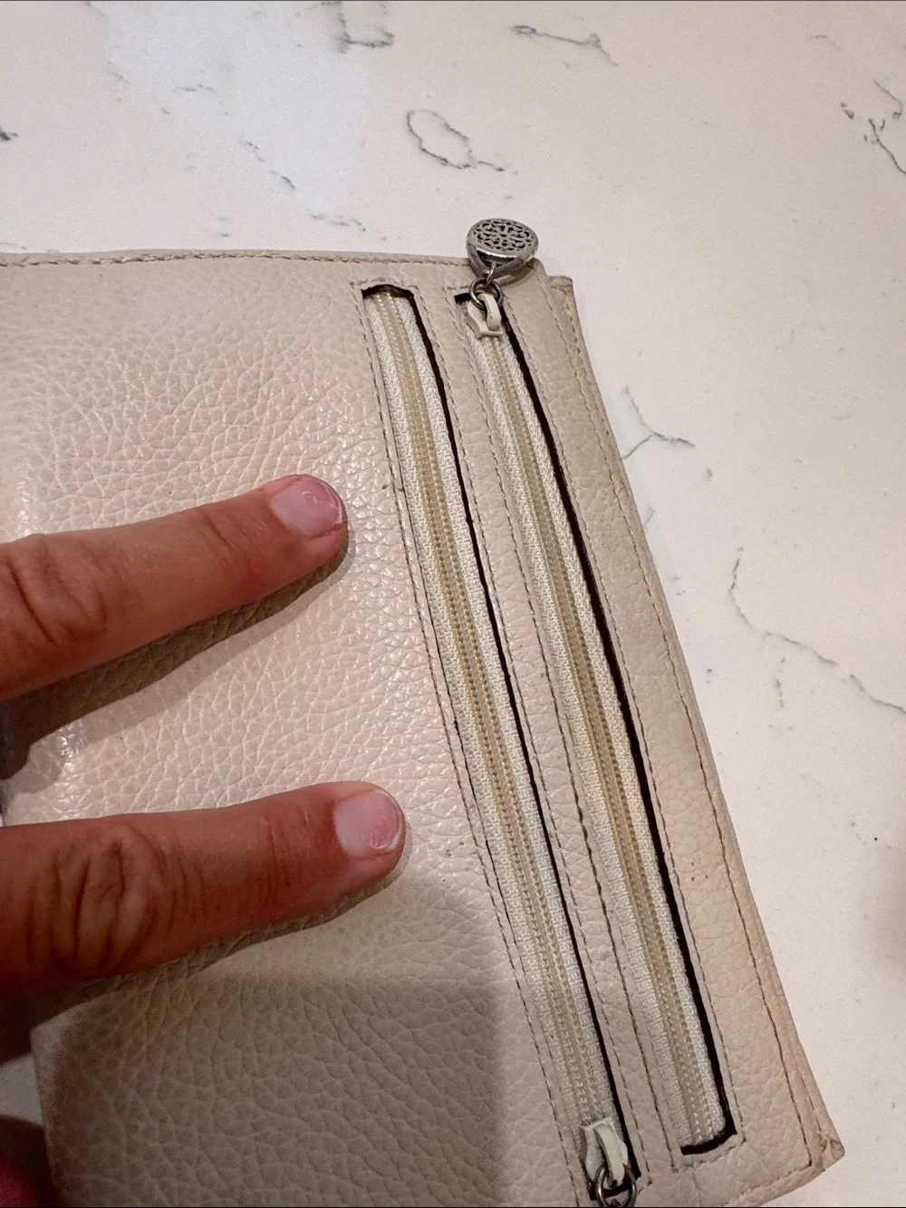 Brighton Cream Pebbled Leather Ferrara Fold Wallet with Embossed Medallion